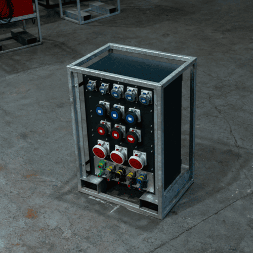 Industrial electrical power distribution box with multiple blue, red, and gray connectors mounted on a metal frame, placed on a concrete floor.