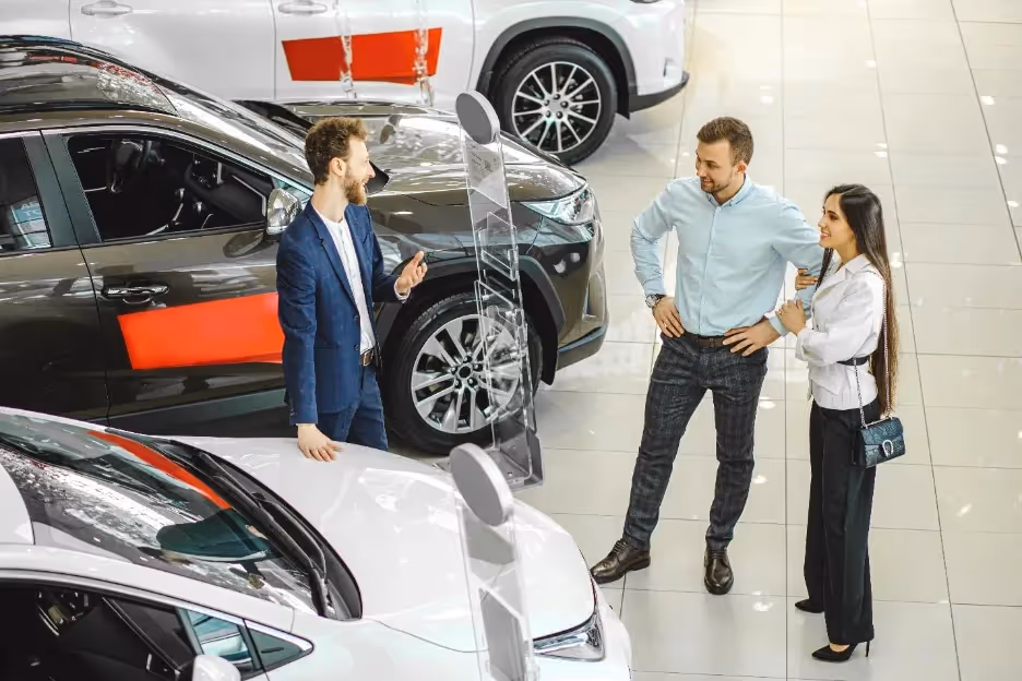 A group of people standing in a showroomAI-generated content may be incorrect.