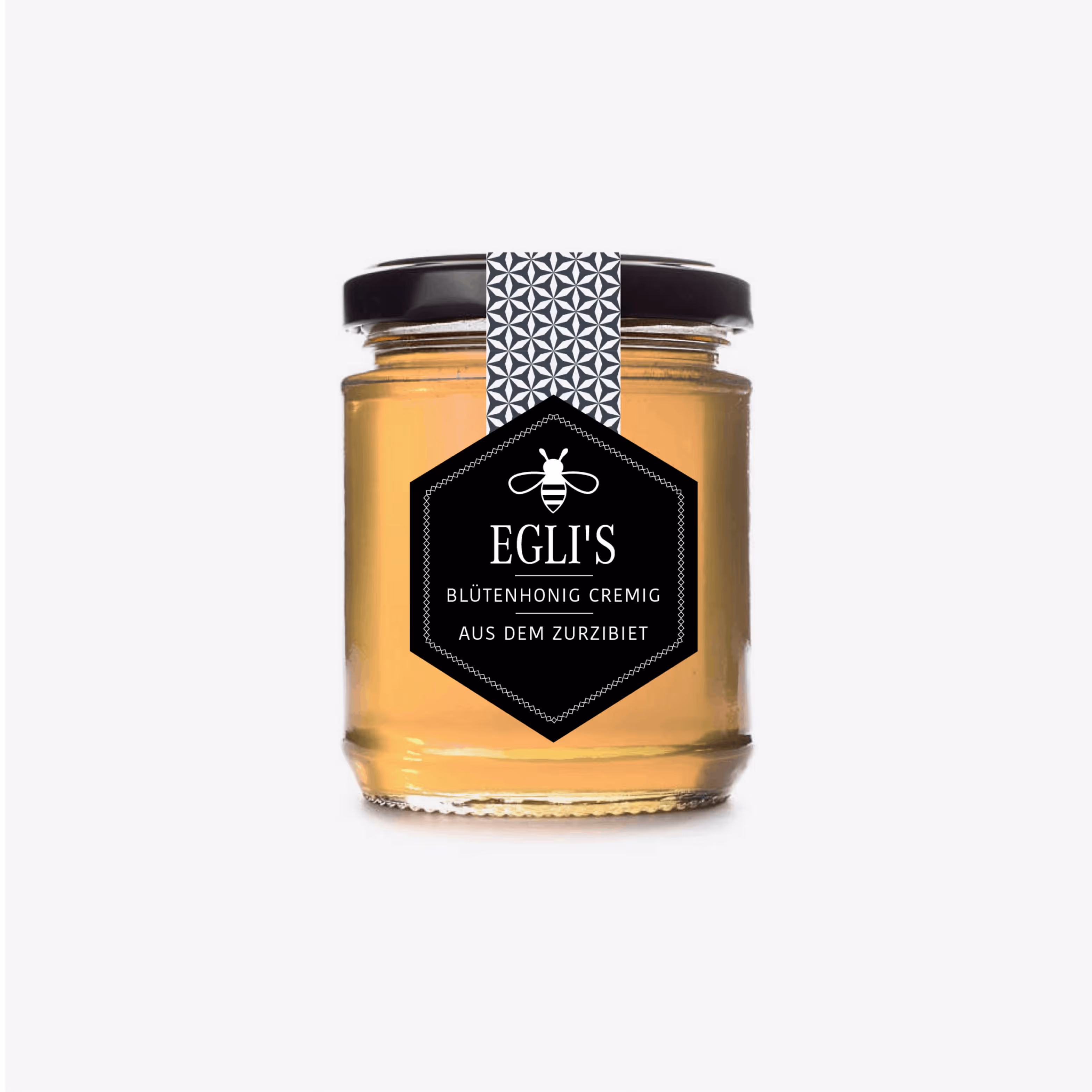 Verpackungsdesign für Egli’s Honig: geometrisches Bienenwaben-Muster, das auffällt im Regal. Markante Produktgestaltung von Grafik-Art.