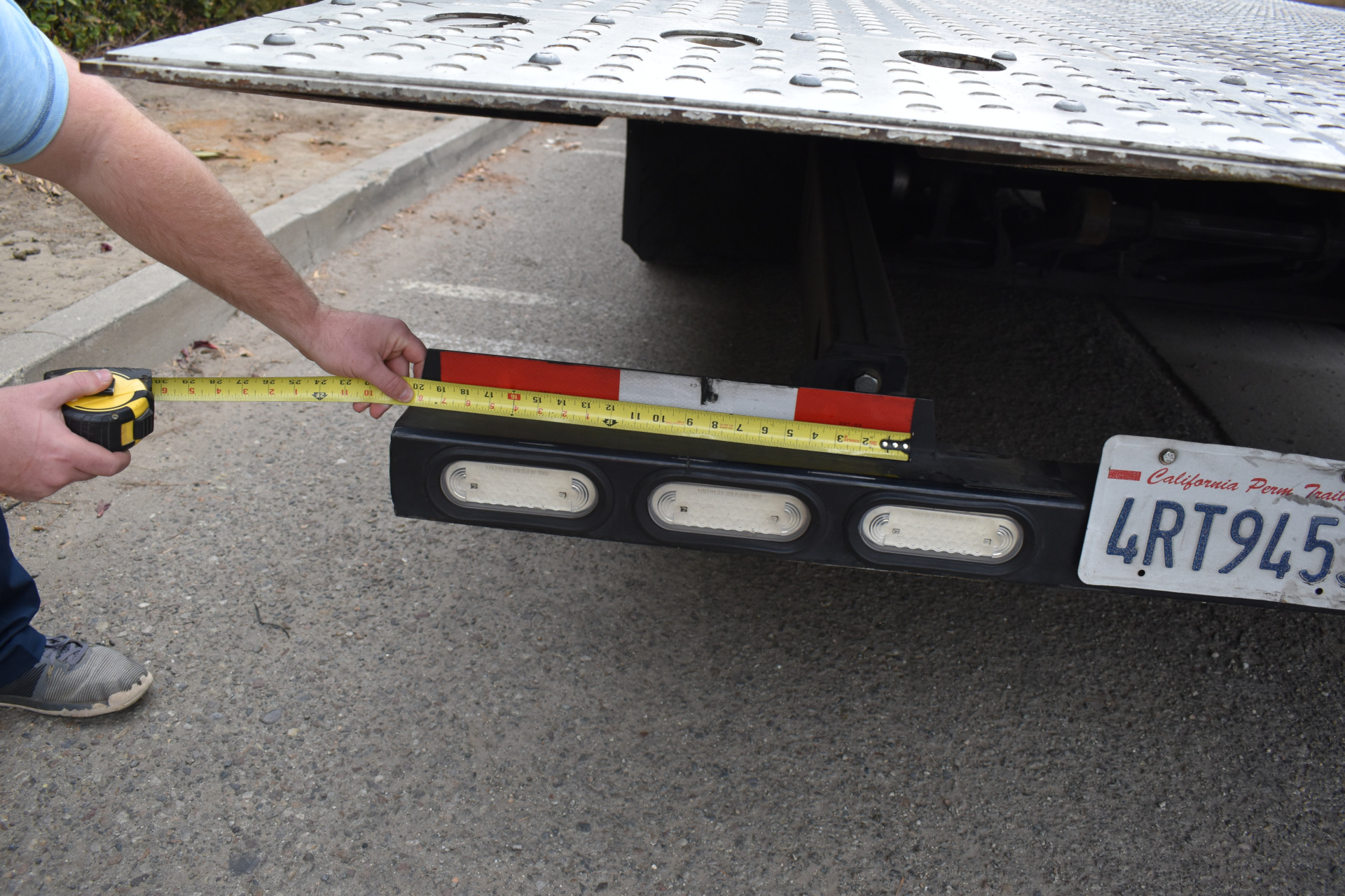 Reflective tape measurement on vehicle for nighttime visibility and looming perception analysis