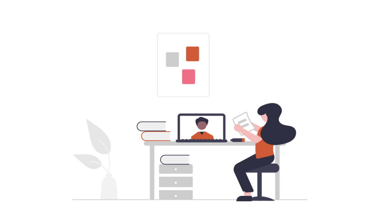 Woman using a learning management system at her desk on her laptop