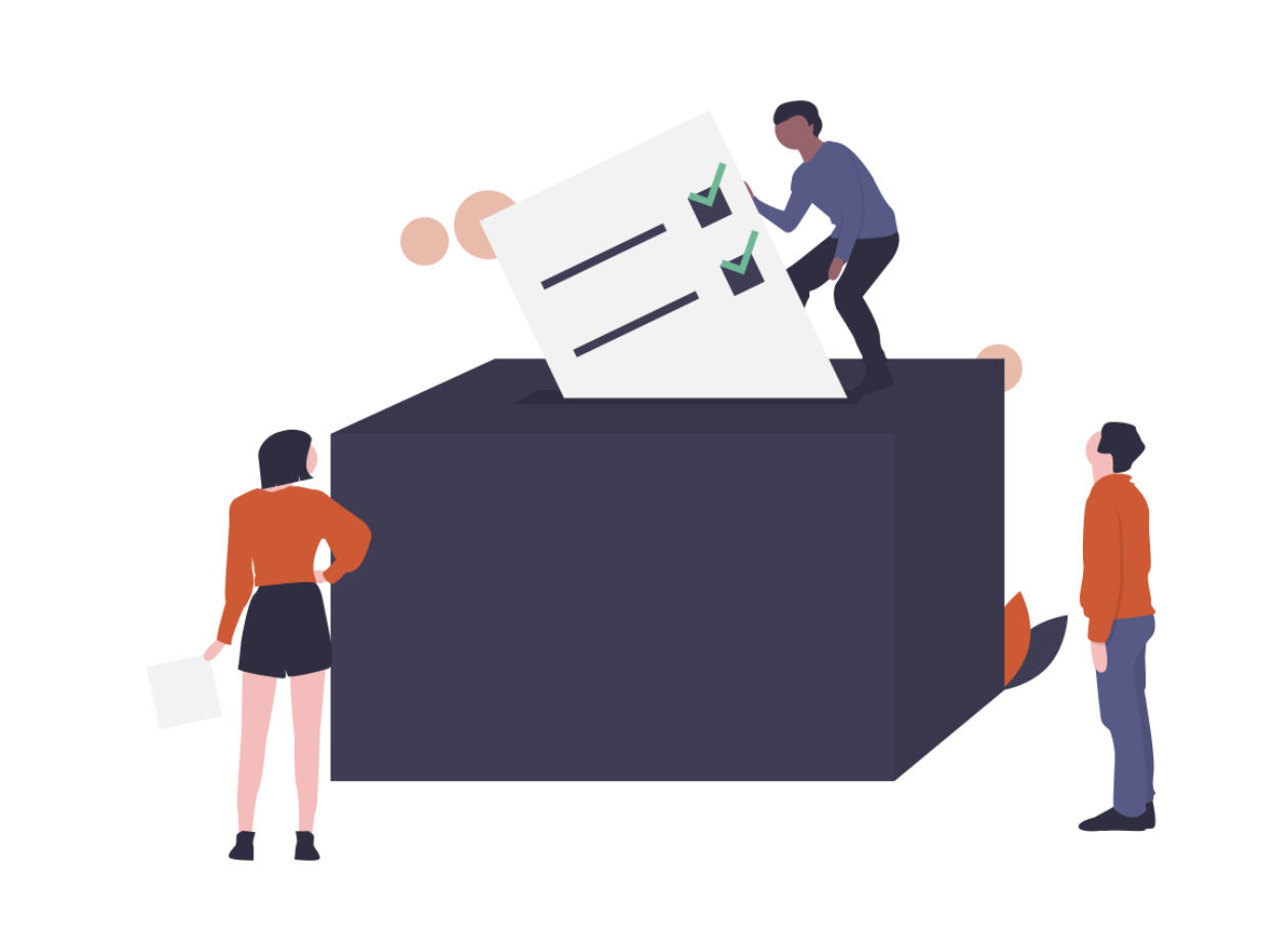 A man placing a ballot into a life-size box