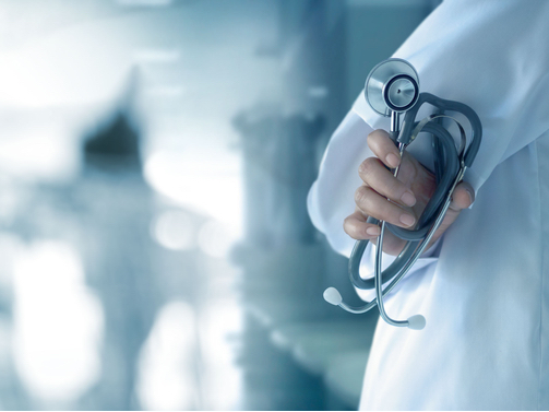 A closeup photo of a doctor holding a stethoscope