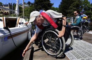 Bob Ewing, co-founder of the Footloose Sailing Association, readies his sailboat to take others with disabilities out for a sail on Lake Washington. He’s been running the program for more than a quarter-century. (Alan Berner/The Seattle Times)