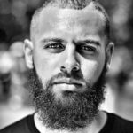 Image of African-American man with full beard and short hair