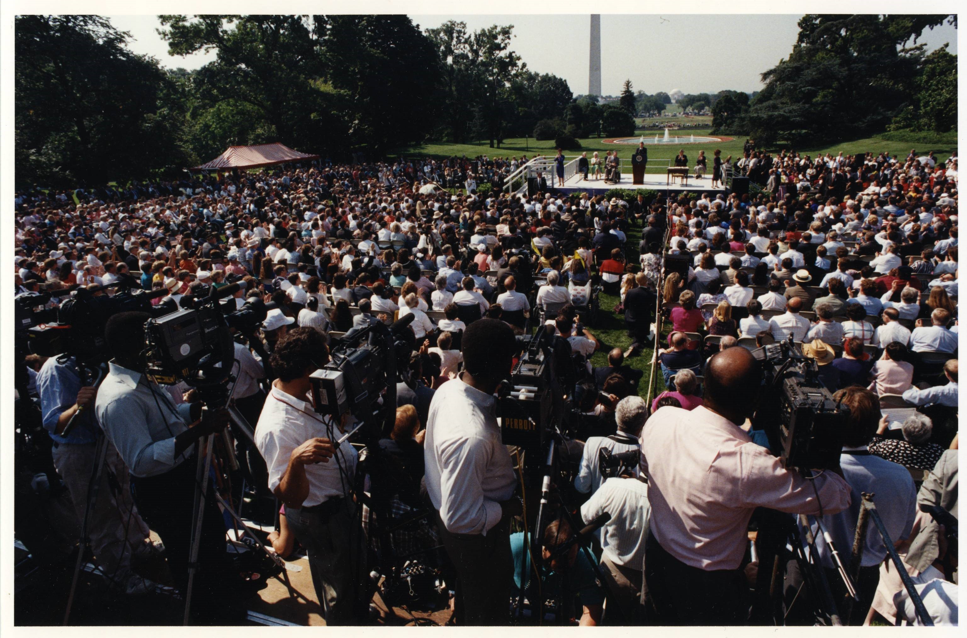 Hundreds gather on the South Lawn of the White House on July 25, 1990, to hear President George H.W. Bush speak minutes prior to signing the Americans with Disabilities Act of 1990.