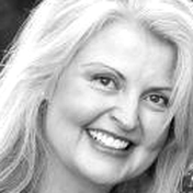 B&W image of smiling woman with long hair