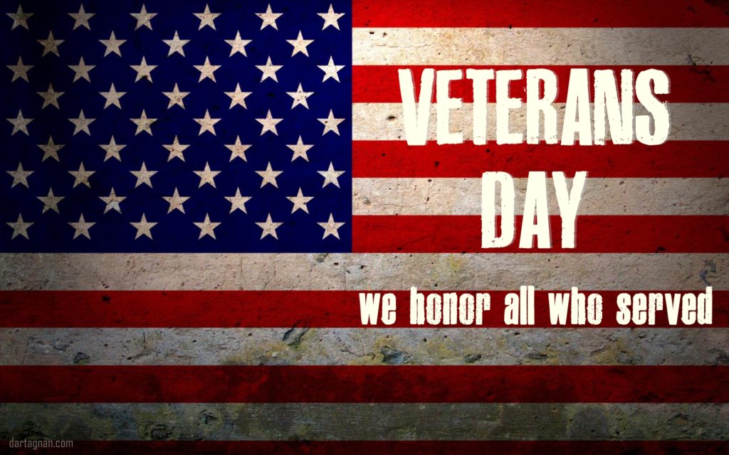 Image of an American Flag with the words, Veterans Day in Honor of all who served