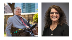 A well dressed older man (Lex Frieden) in a gray jacket and gray shirt with a cranberry tie sits outside in a power wheelchair and looks into the distance and a woman in glasses with curly hair wearing black (Merrill Friedman)