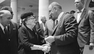 President Lyndon Johnson offers Dr. Ethel Percy Andrus a pen he used to sign the Older Americans Act. Source: https://www.aarp.org/about-aarp/history/older-americans-act-1965.html