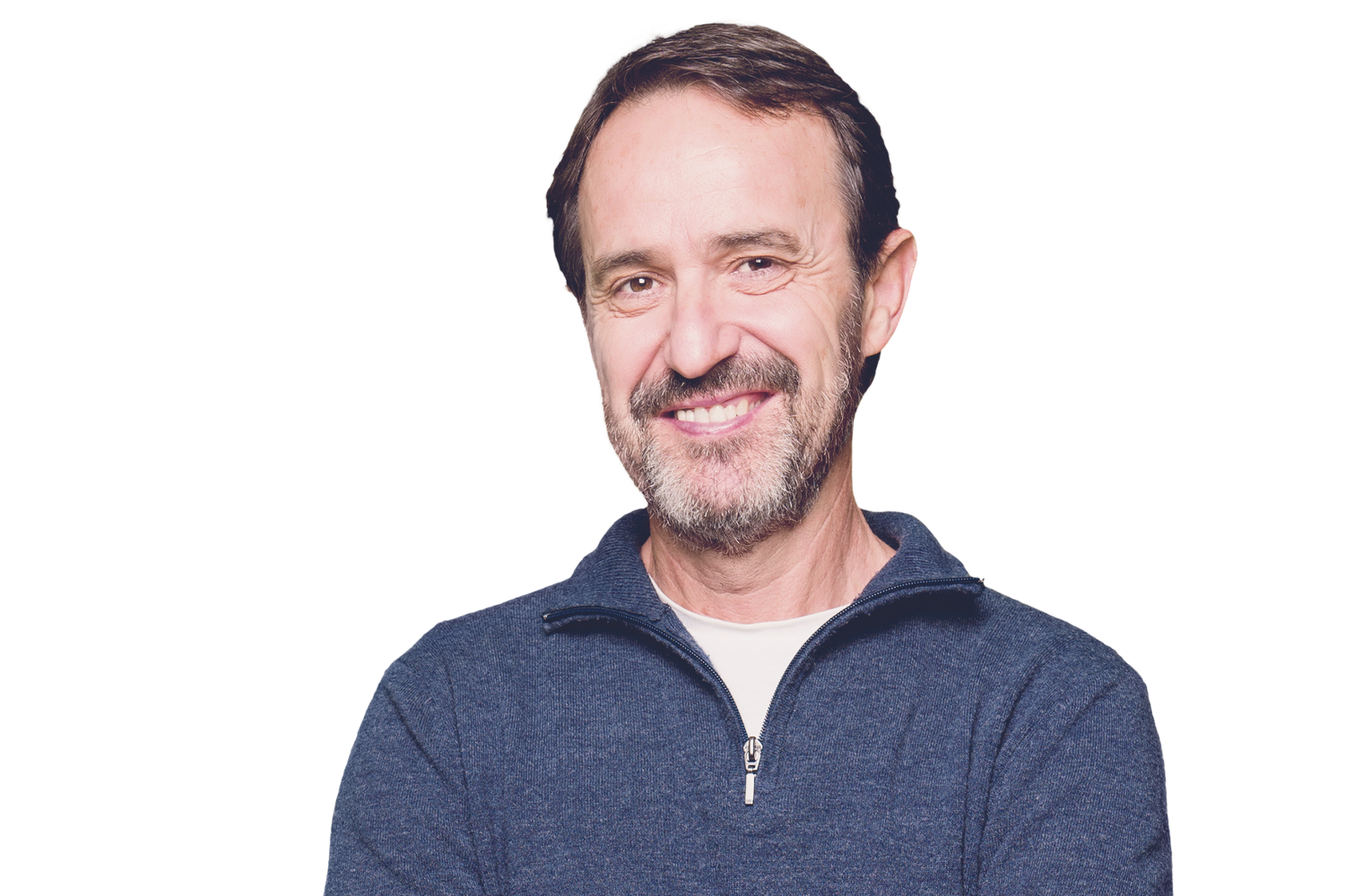 An isolated photo of a light skinned male with dark hair, smiling.