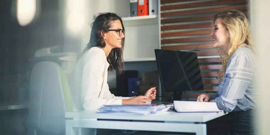 two women in a meeting