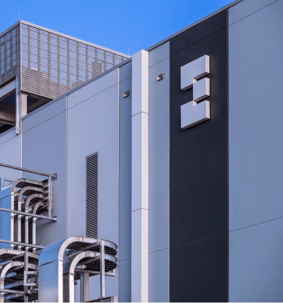 Abstract geometric sculpture against a blue sky