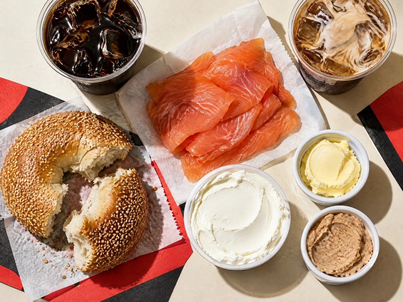 Smoked salmon, organic cold brew, cream cheese, butters, and a pulled-apart sesame bagel