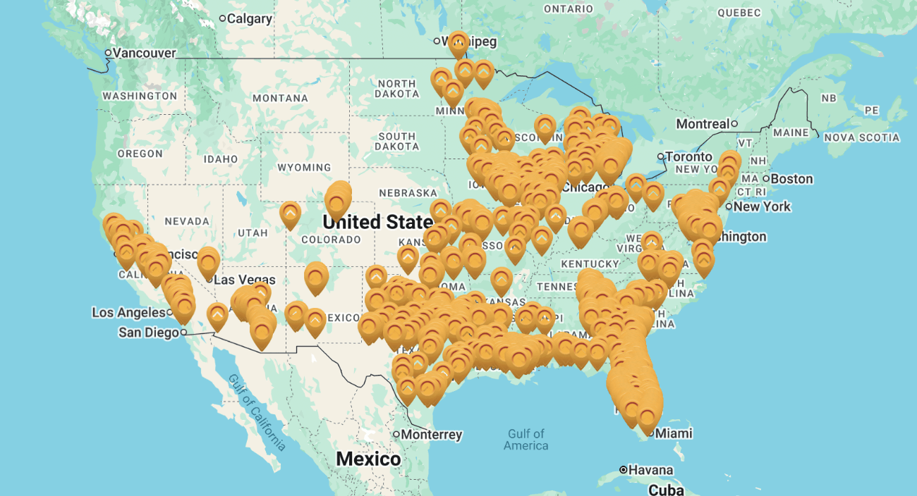 Map of the United States and southern Canada with numerous orange location markers densely clustered in the eastern, central, and southwestern US regions.