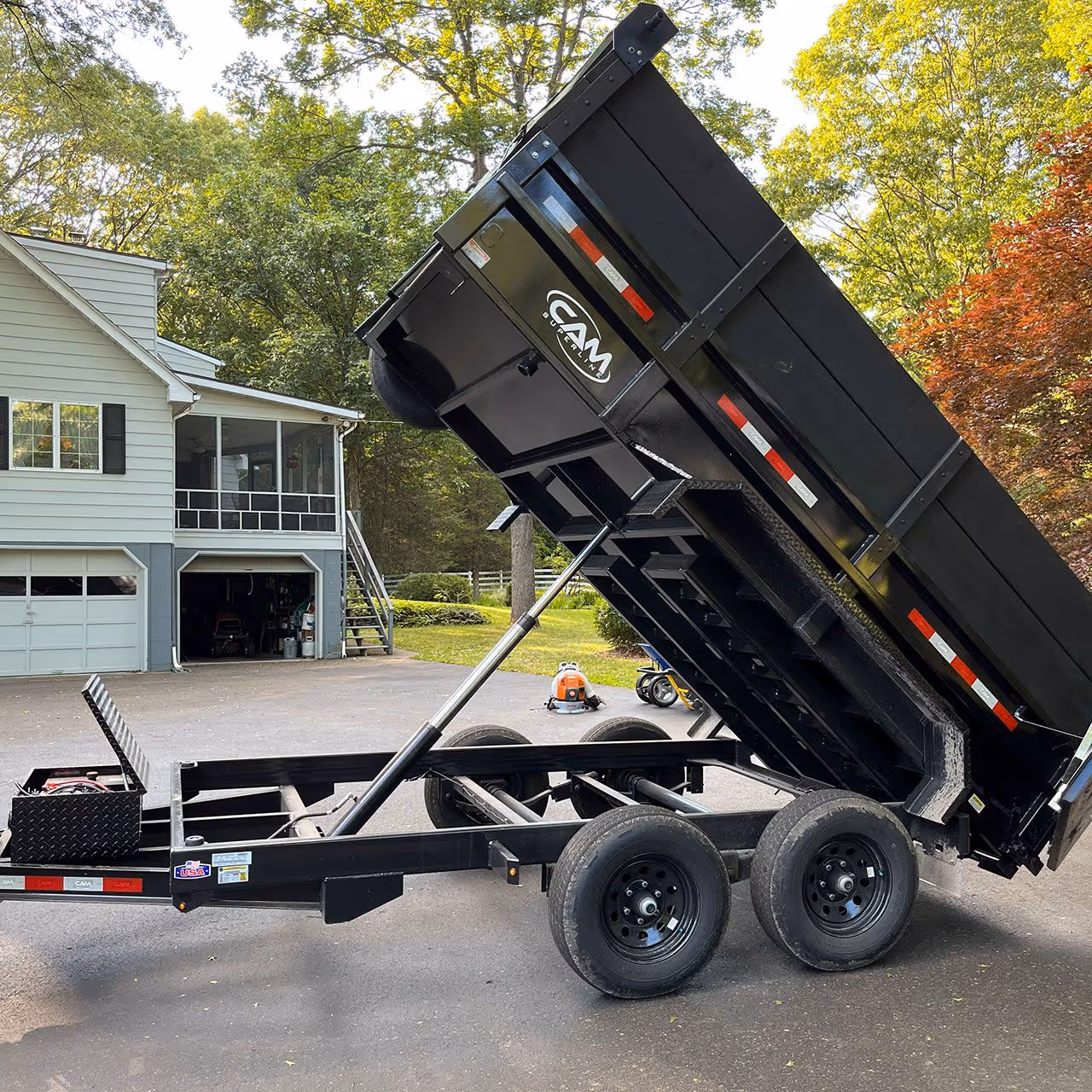 Dumpster on site for property cleanup and debris removal by Higher Ground Property Management LLC in Red Hook NY