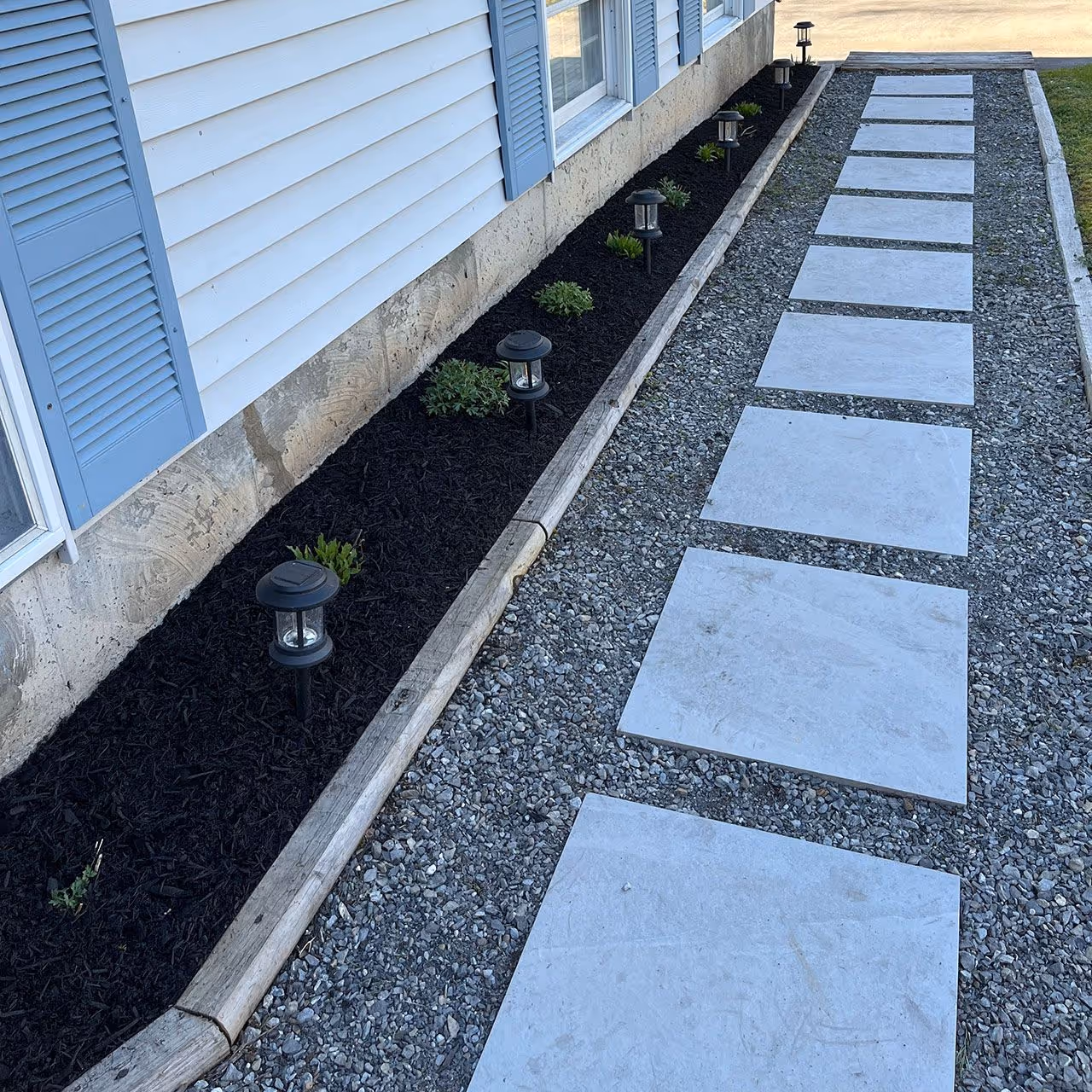 Paver walkway and patio installation by Higher Ground Property Management LLC enhancing outdoor space in Red Hook NY