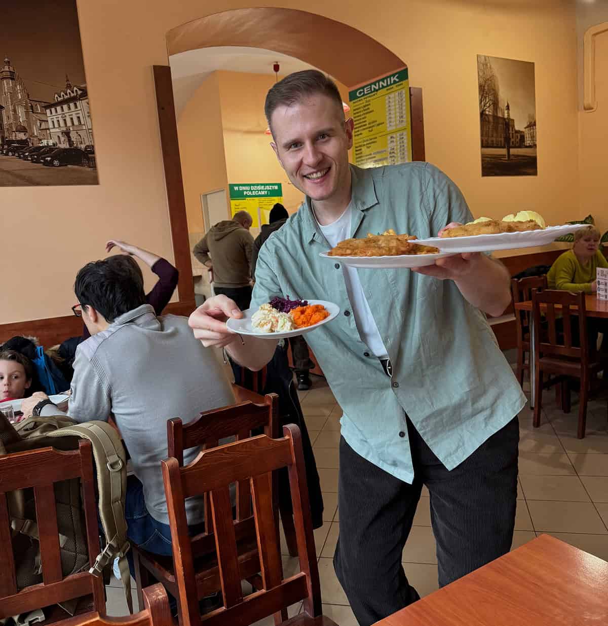 Adrian sharing traditional Polish food and culture in a local restaurant