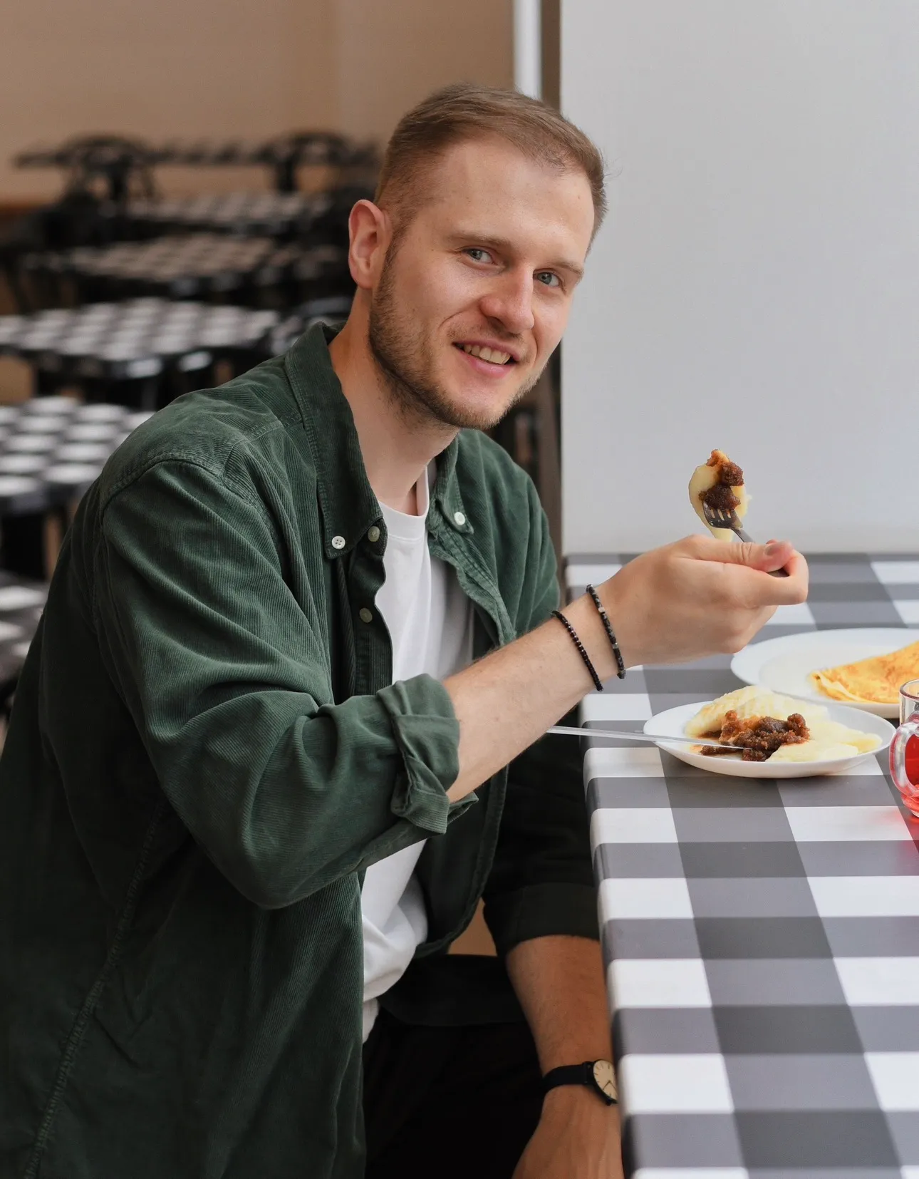Adrian sharing traditional Polish food and culture in a local restaurant