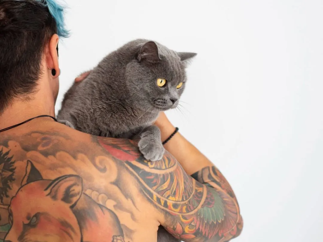 man being affectionate with cute cat