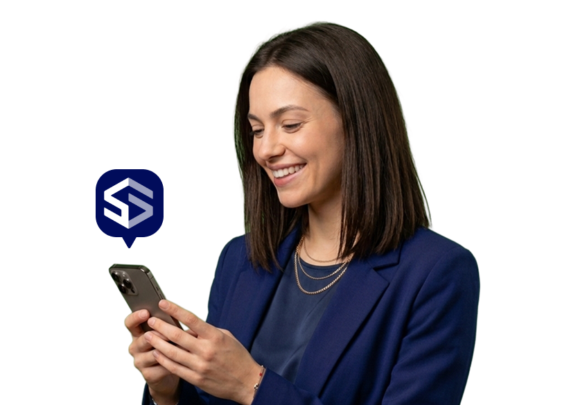 Smiling woman in navy blazer looking at her smartphone with a blue chat bubble containing a white and gray abstract logo.