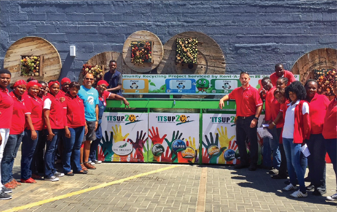 Gondwana Collection Namibia team standing in front of recycling containers.