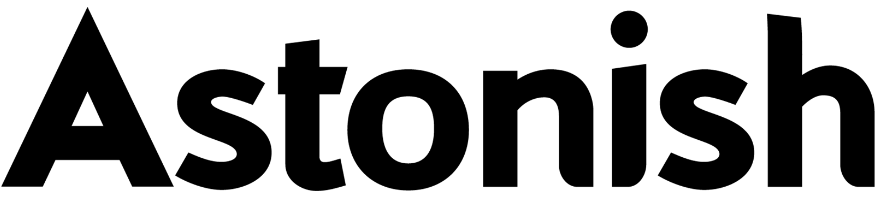 Black silhouette of a fluffy dog in a sitting position.