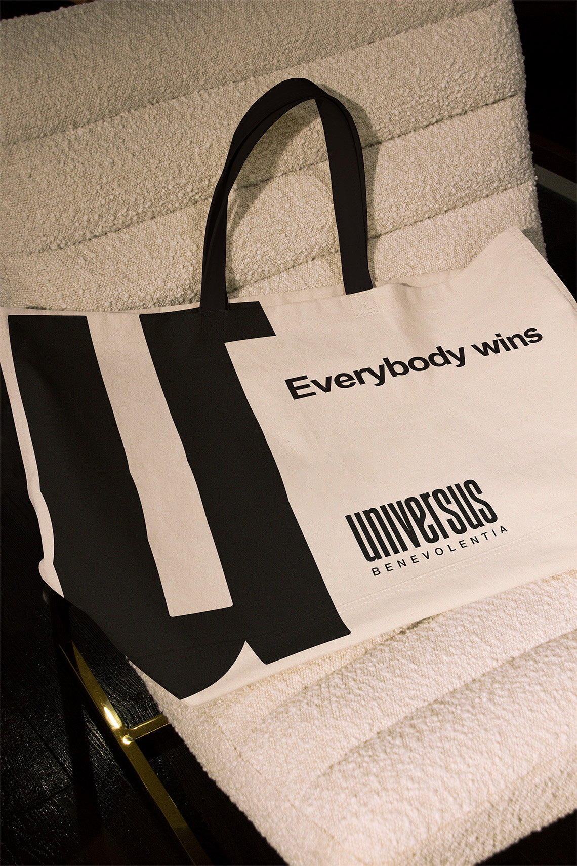 Branded black and white tote bag for a clothing brand