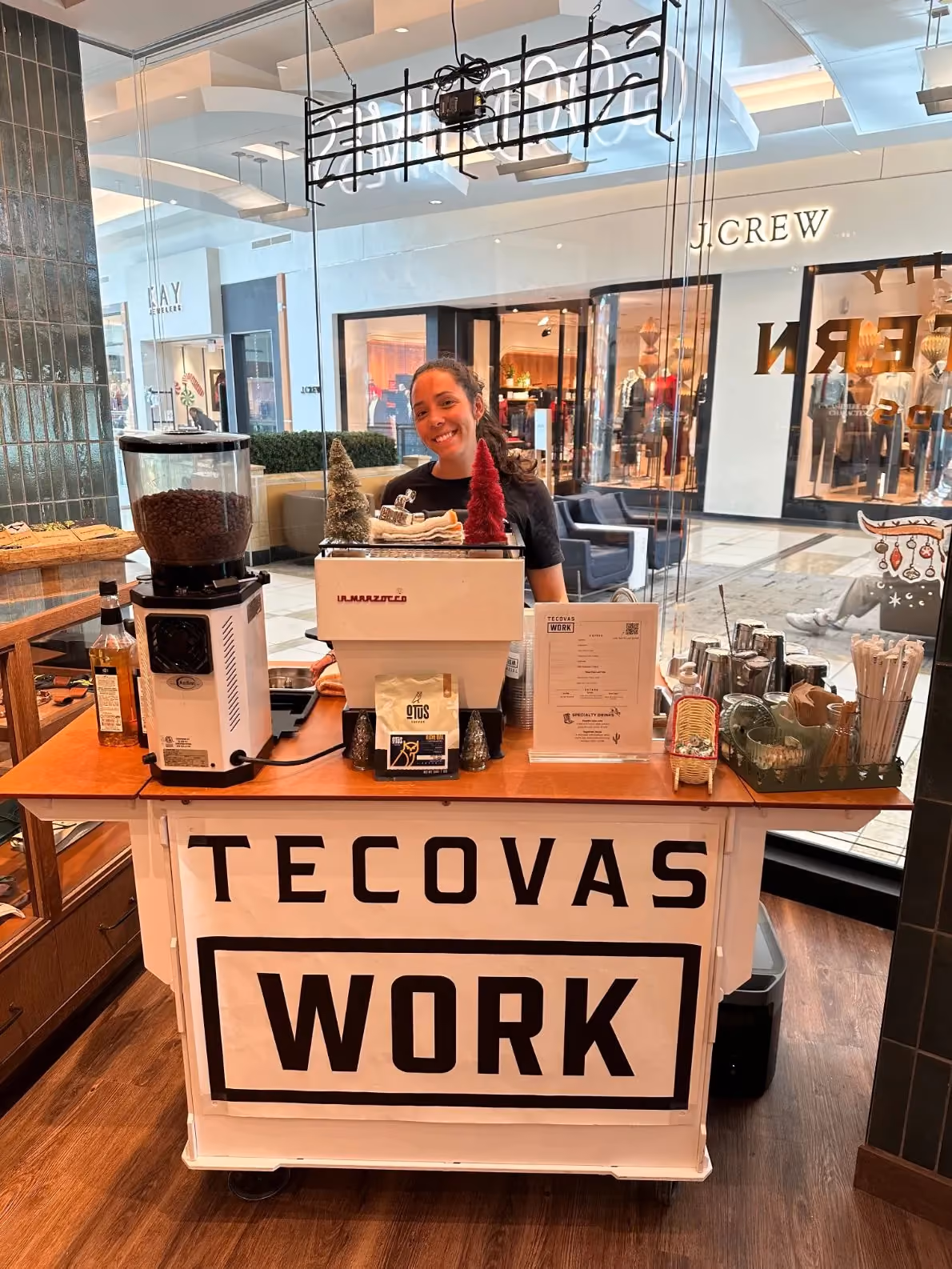 Dyllan Allen behind the custom Tecovas-branded Sage's Playground coffee cart at a Tecovas event in Tampa Bay
