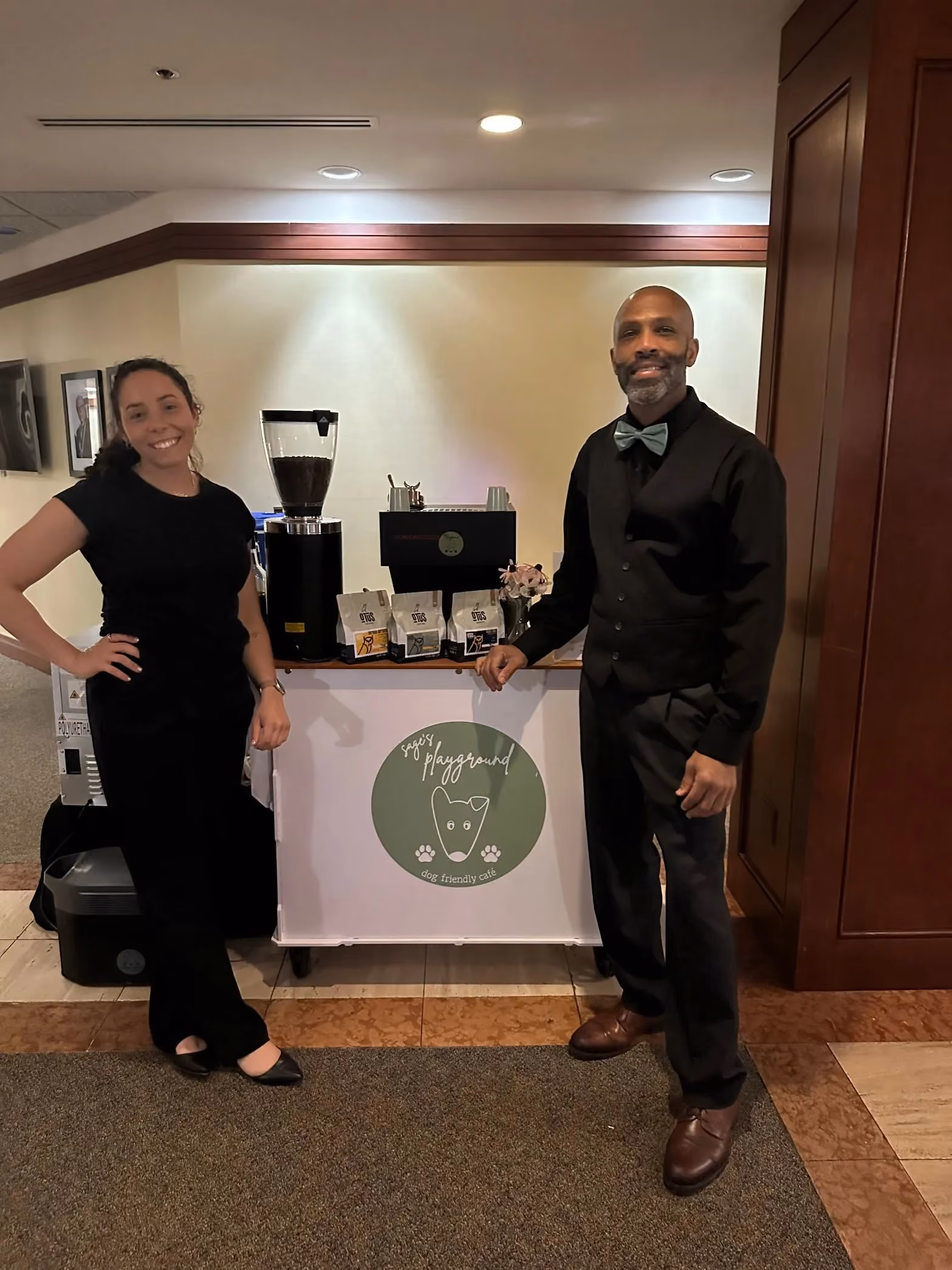 Dyllan and Roy Allen in front of the Sage's Playground espresso cart at a Tampa Bay wedding
