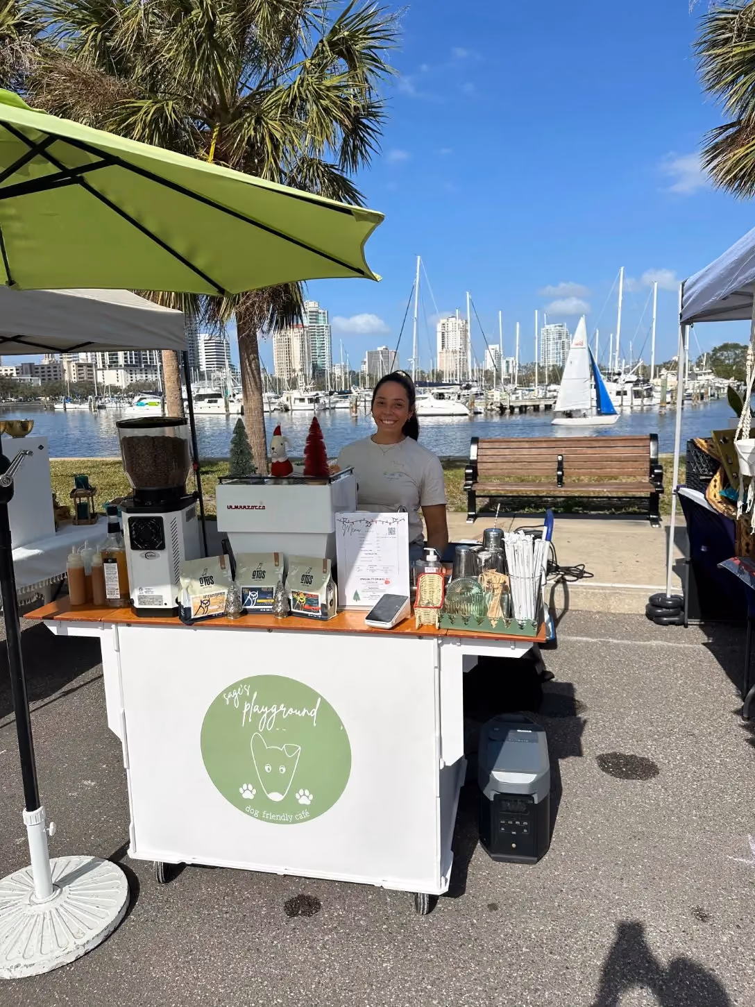 Dyllan serving specialty coffee from the Sage's Playground cart on the St. Petersburg waterfront