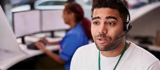 An emergency call-taker working in a hospital communication center.
