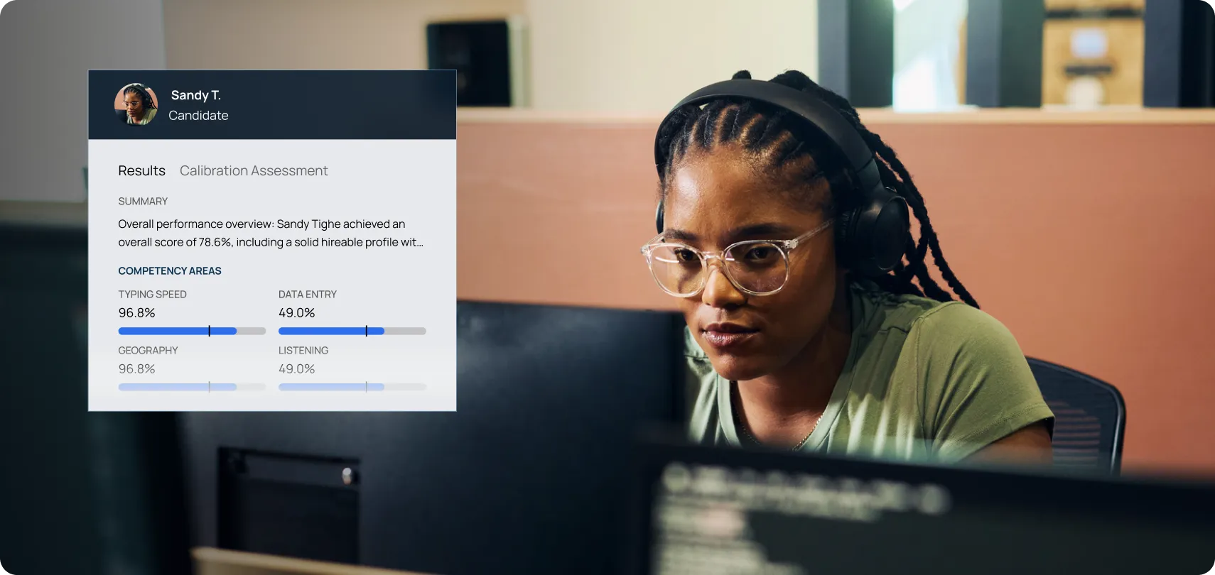 A 9-1-1 dispatcher candidate taking an assessment test at a computer.