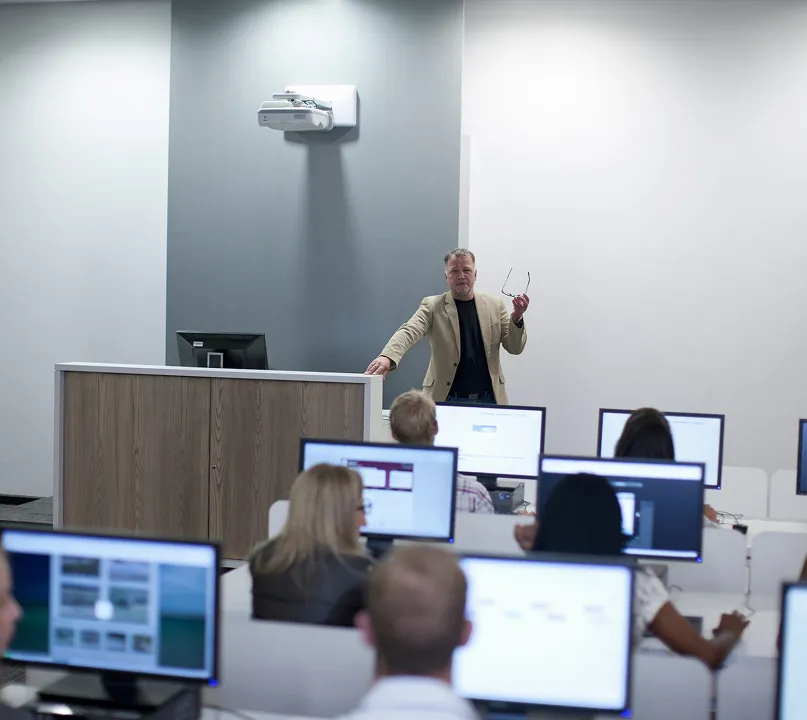 A 9-1-1 professional teaches a class on emergency communications.