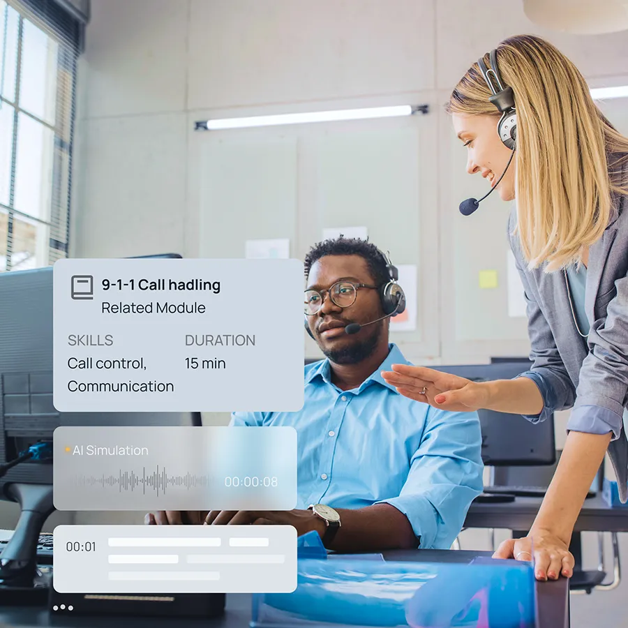 An instructor coaches a 9-1-1 trainee.