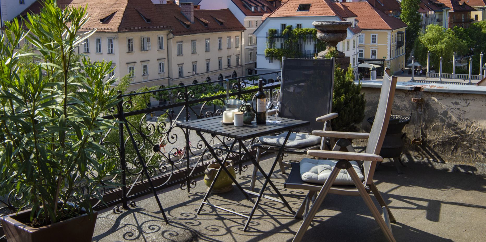 Ljubljana rooftop with a cute little table and chairs.