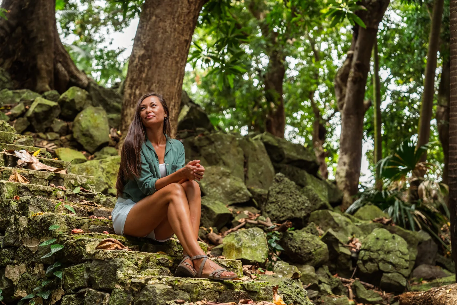 Resident seated on stone steps in Spring Park, Anahita Beau Champ