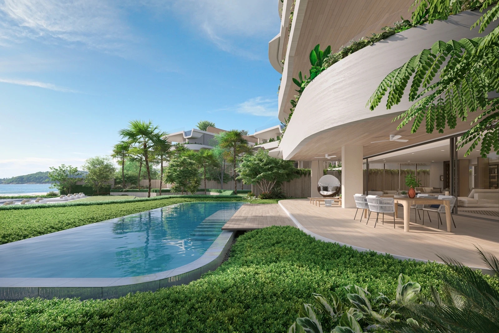 Garden pool and covered terrace beside the beachfront residence