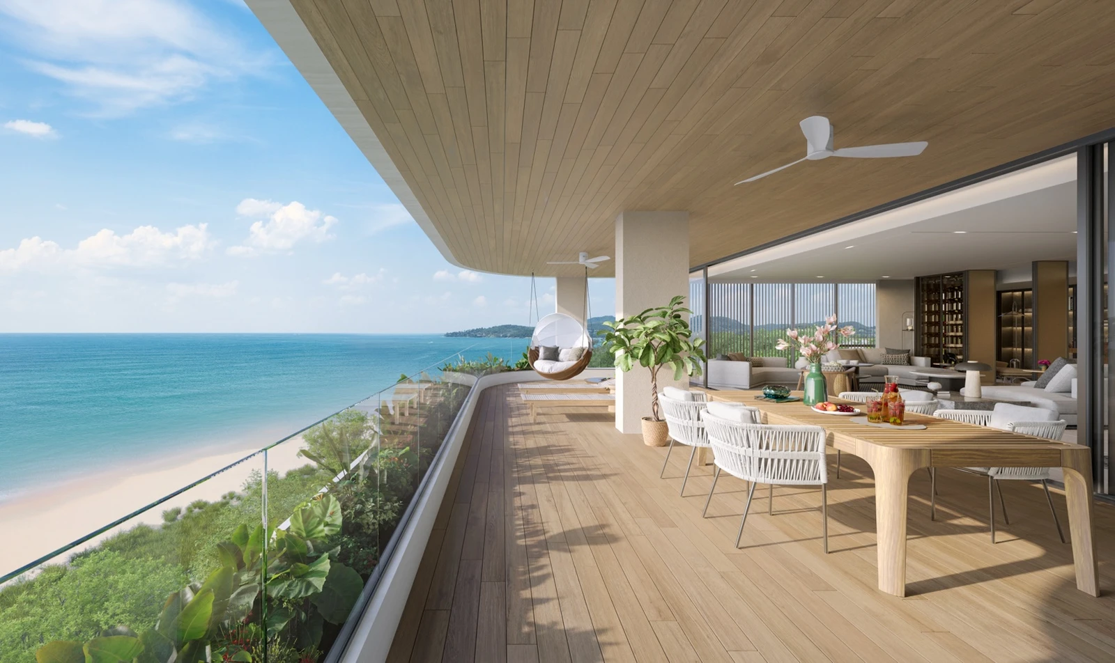 Oceanfront dining terrace opening to the living room