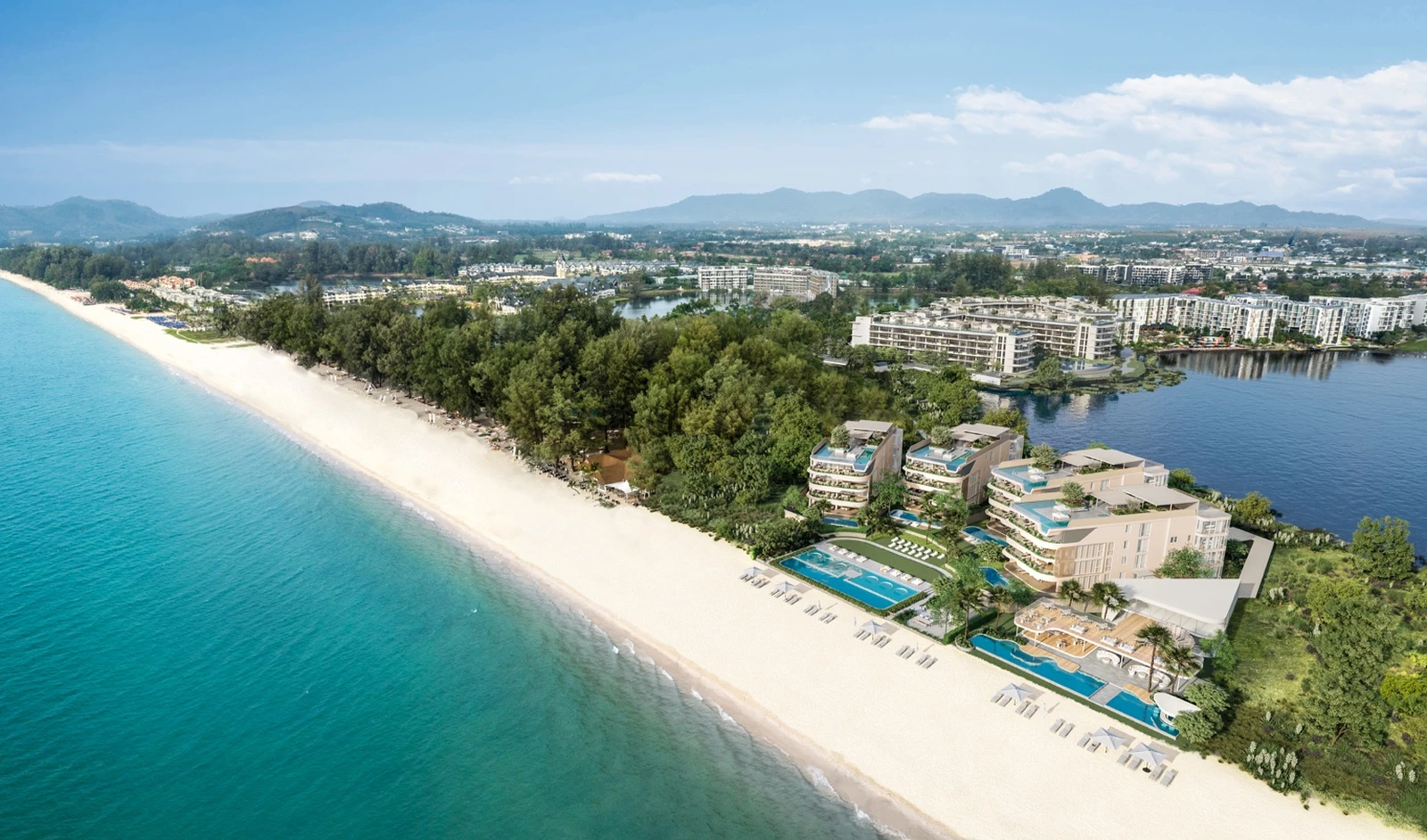Beachfront site view with residences, pools, and shoreline