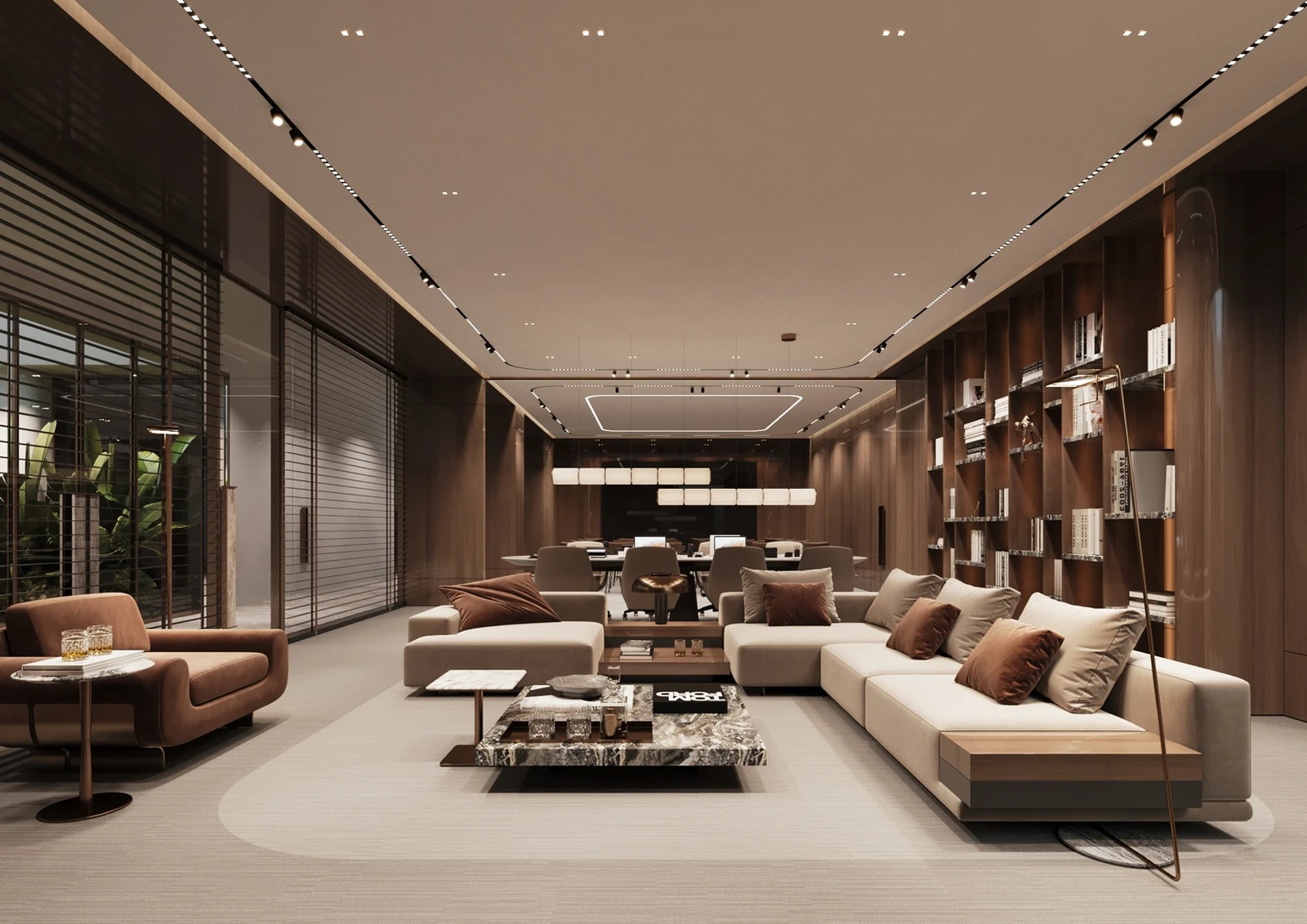 Co-working lounge with seating, library shelving, and work tables