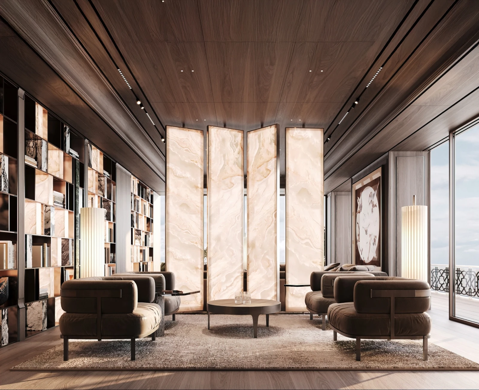 Library lounge with illuminated stone screens and sea-view terrace