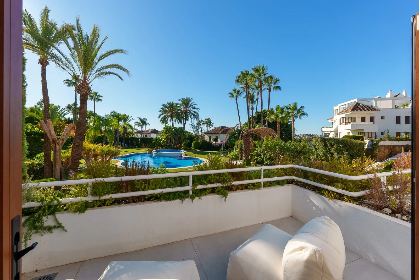 Terrace with pool and landscaped garden outlook