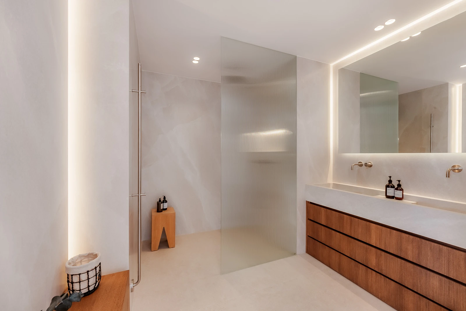 Primary bathroom with double vanity and walk-in shower