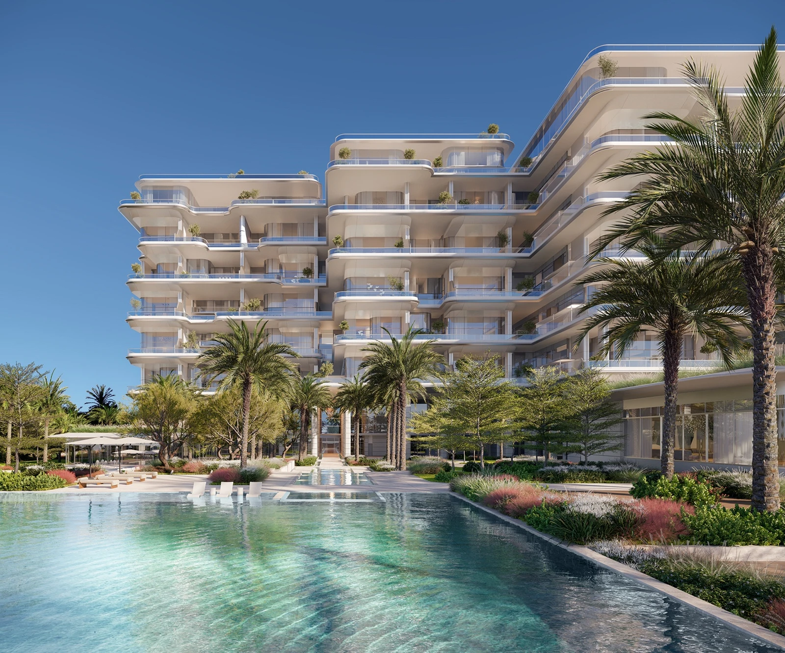 Pool courtyard and residential facade framed by palm landscaping