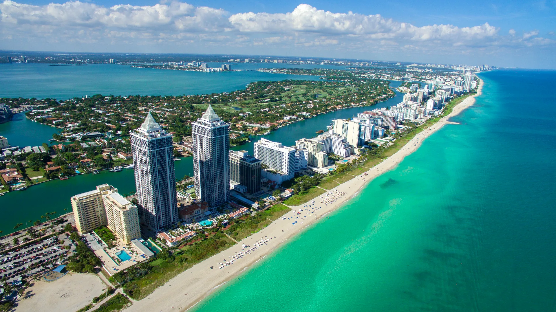 Aerial view of Mid-Beach, Miami Beach - condominium towers on Collins Avenue's Millionaire's Row between the Atlantic Ocean and Indian Creek waterway