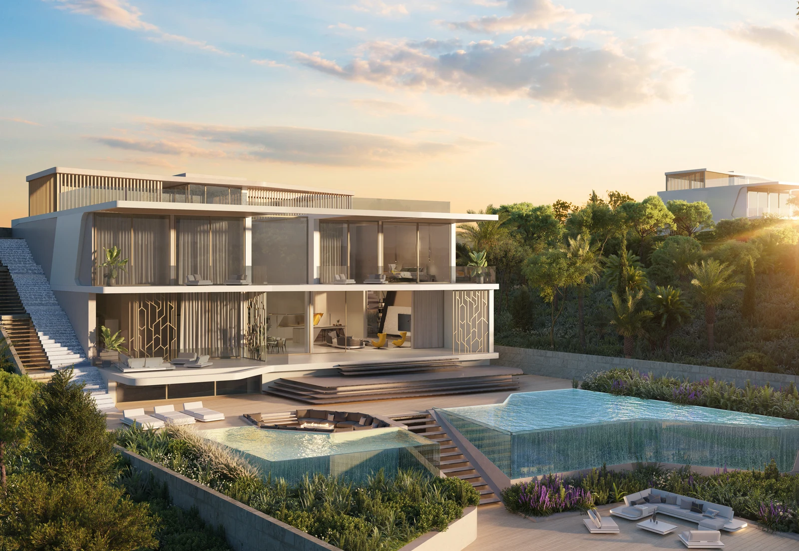 Sunset exterior of a Tierra Viva villa with stacked glass-walled terraces, geometric metal screens, twin infinity pools and a sunken fire-pit lounge on the Benahavís hillside