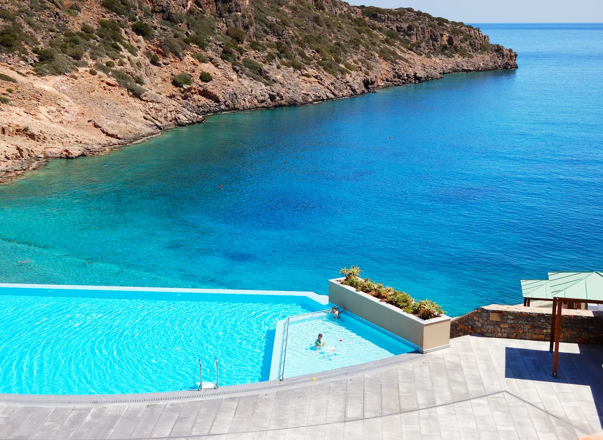 Seaside villa with an infinity pool in Greece, where the property is the qualifying asset