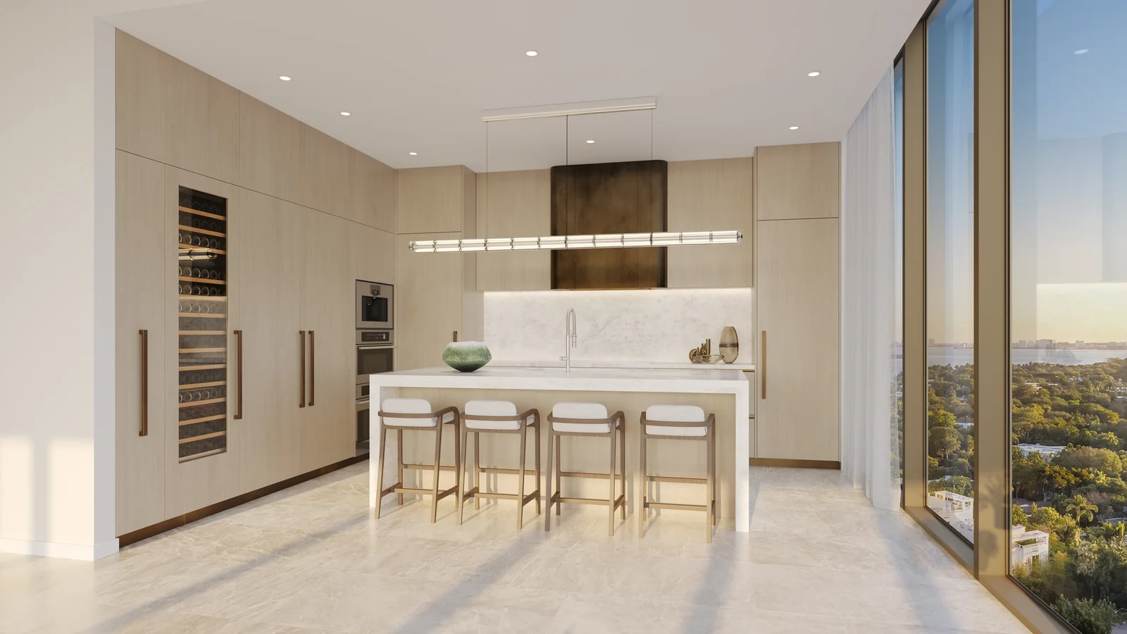 Kempinski Residences gourmet kitchen with waterfall island, Gaggenau appliances and wine cabinet