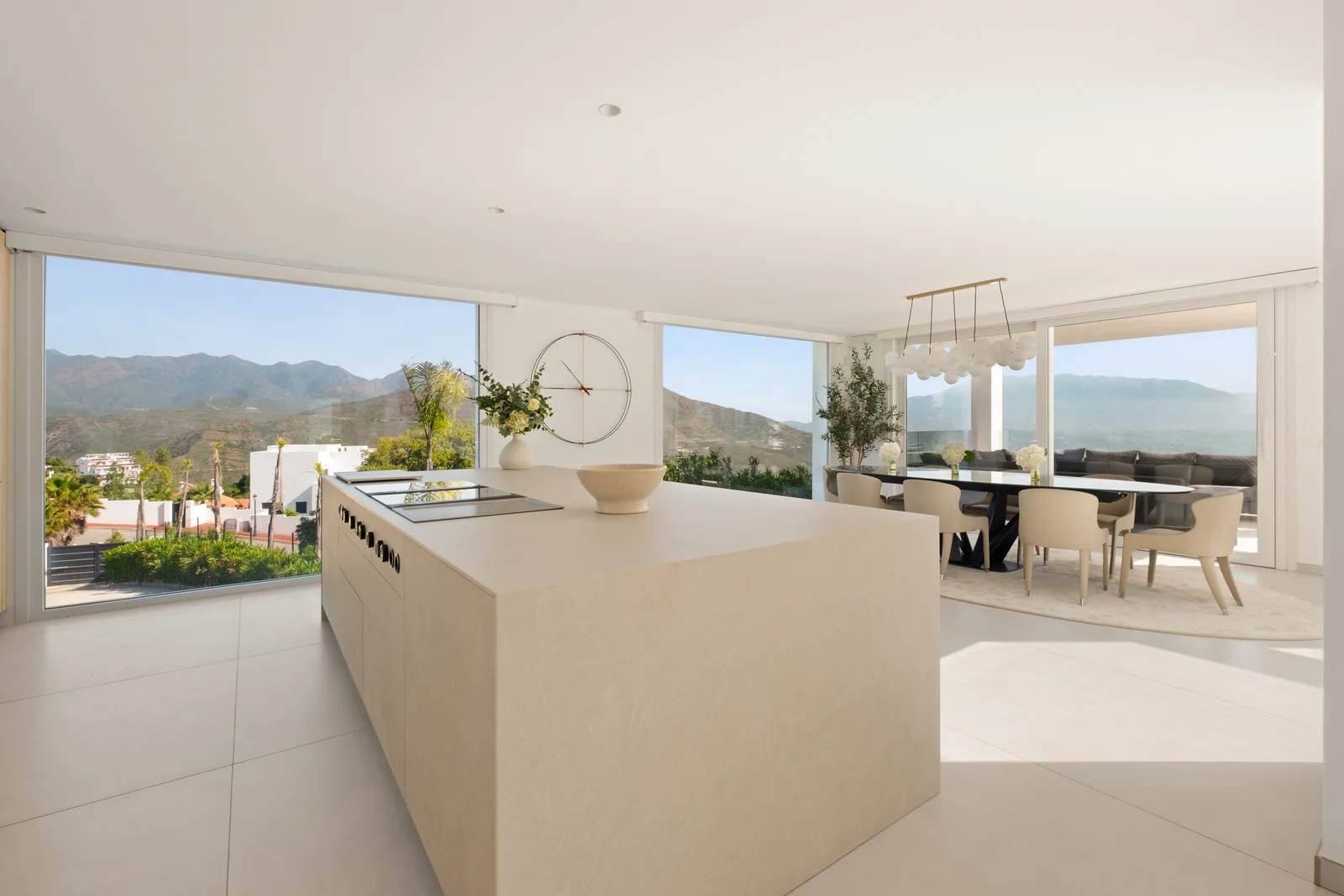 Buganville Villa open-plan kitchen with island and panoramic terrace view